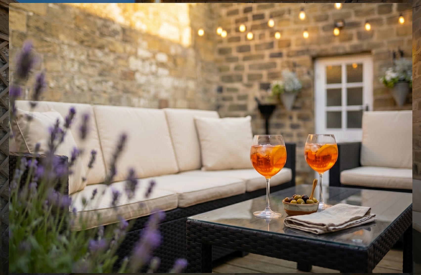 Aperol spritz on the courtyard terrace, festoon lights on